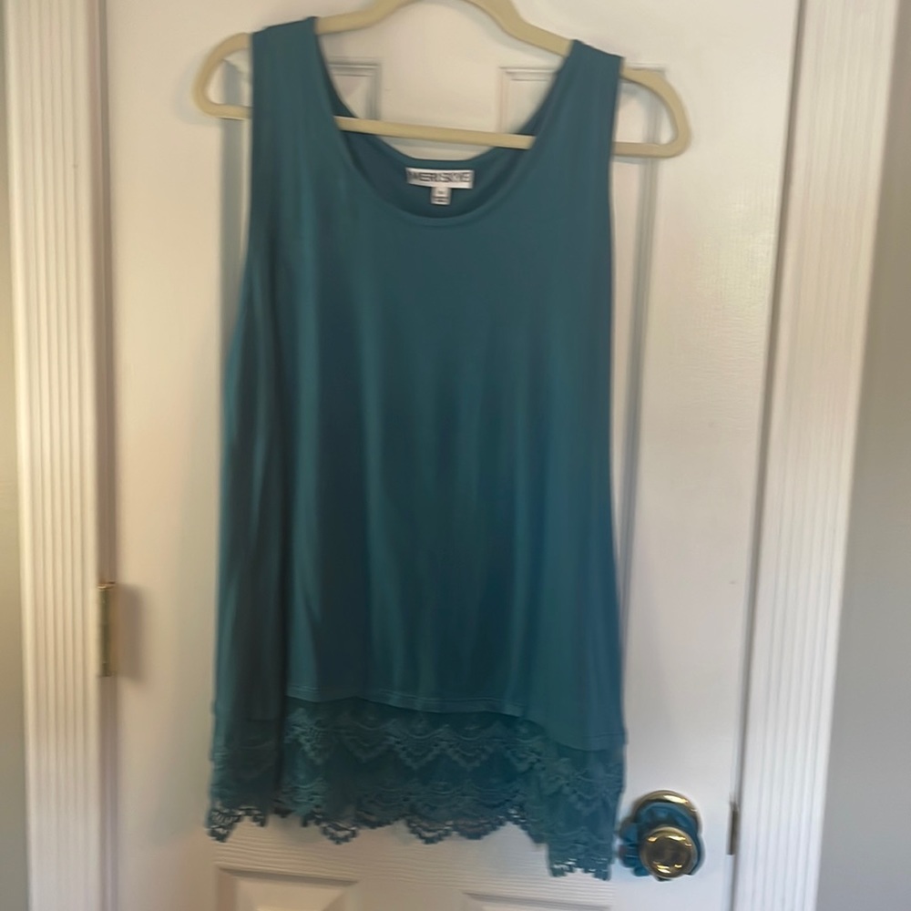 Teal sleeveless shirt with lace detail on bottom. Never worn . No tags